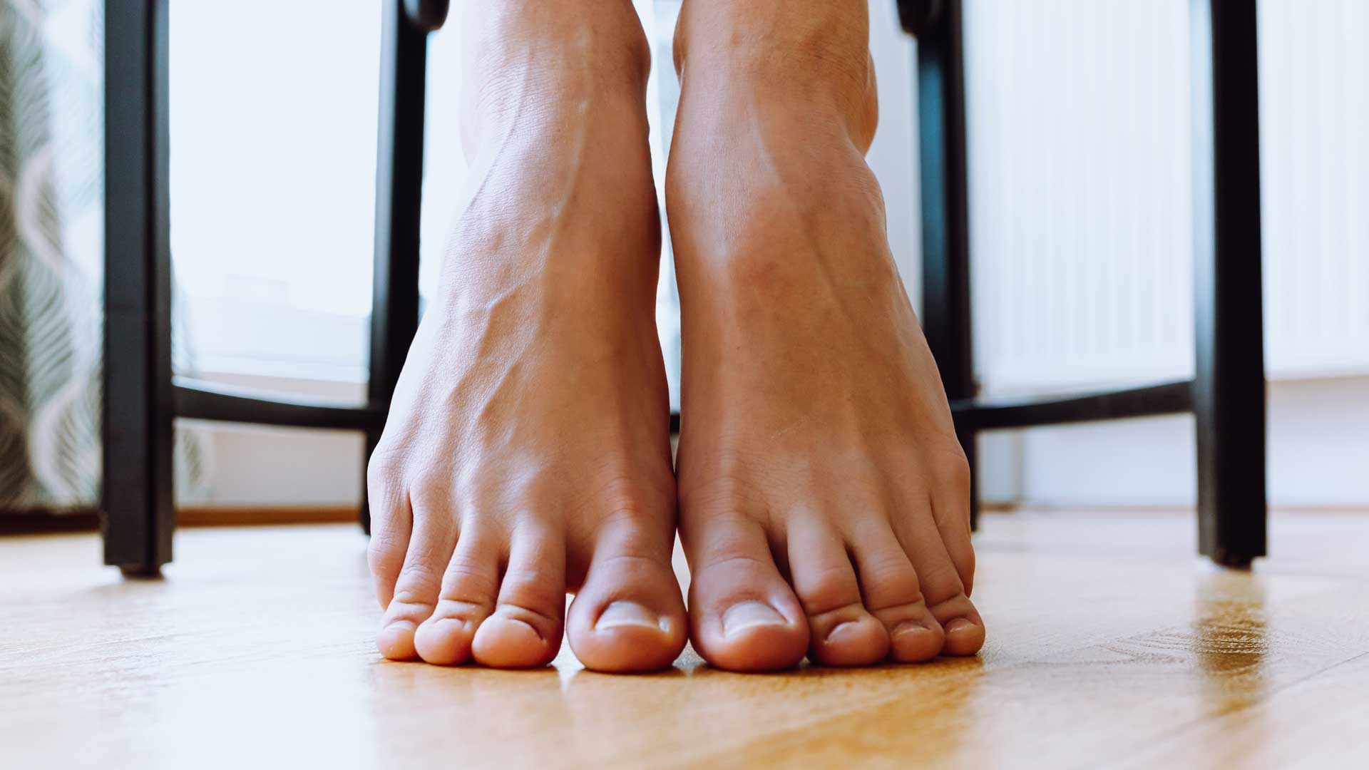 feet with toes on floor