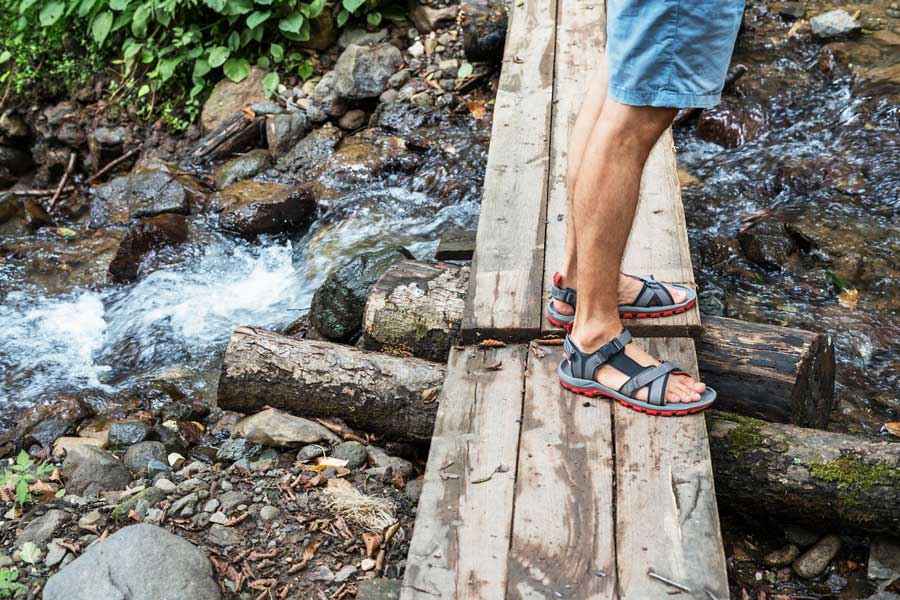 man in sandals in nature